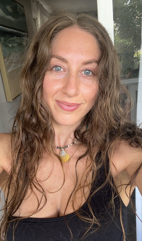 Malana after swimming, wearing her shell necklace
