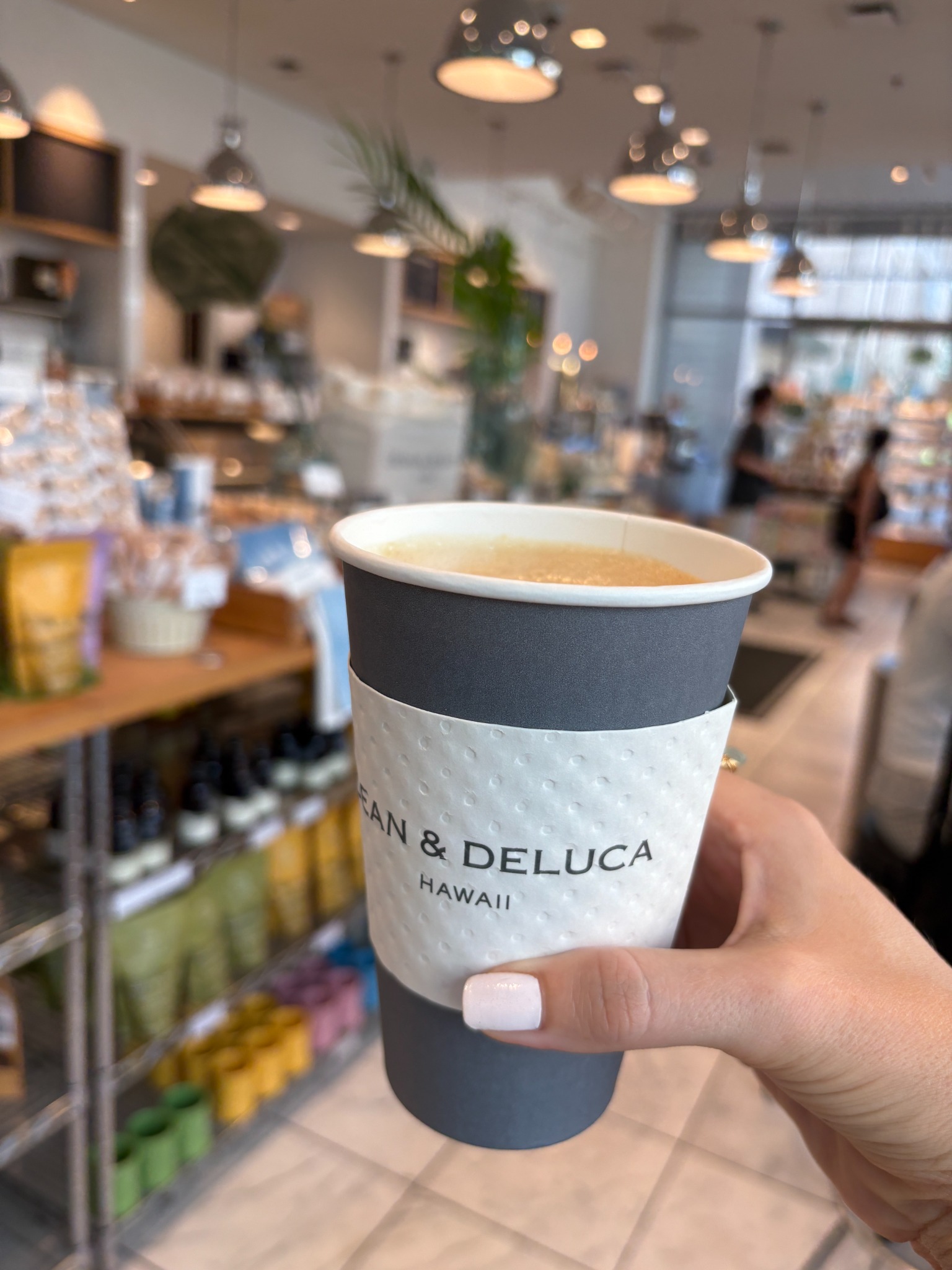 Coffee in hand at a café in Hawaiʻi